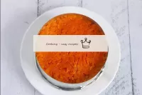 The third layer is grated boiled carrots, which al...