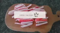 Crab sticks are cut with straws. Fry in a pan unti...