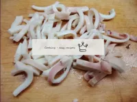 Cut the squid into strips...