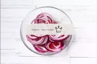 Peel the red onion and cut into thin rings or half...