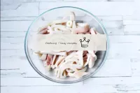 Chill the ready-made squid, cut into strips or thi...