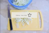 Finely chop the cabbage, transfer it to a spacious...