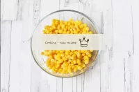 Drain the liquid from the canned corn, dry the gra...