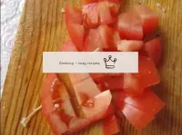 Cut the tomato into small cubes. ...