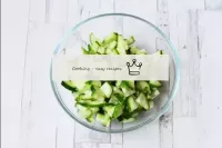 Wash and dry the cucumber. Cut into small cubes. T...