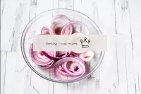 Peel the red onion and cut into thin rings or half...