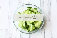 Wash the cucumber, dry and cut into strips. The sk...