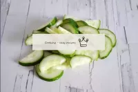 Wash the cucumber, dry and cut into not very thick...