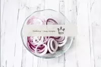 Peel the red onion and cut into thin rings or half...