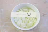 Peel the onions and rinse in cold water. Cut the o...