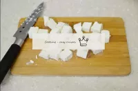 Cut the feta into cubes. When buying feta, pay att...