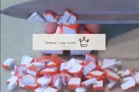 We cut crab sticks into a small cube. Put them in ...