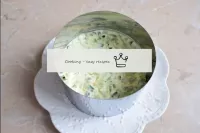 Spoon the chopped cucumber into a third layer of c...