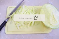 Shave cabbage with a sharp knife. Try to make it a...