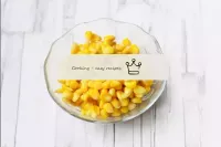 Peel the canned corn on a sieve and dry. ...