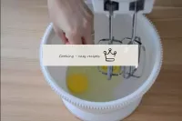 In a whipping container, break the eggs and add a ...