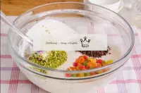 Add candied fruits, chocolate and pistachios to th...