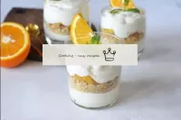 Garnish the creamy dessert with orange wedges and ...