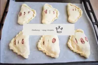 Line a baking tray with cooking paper and place th...