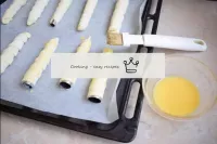 Brush the tubes with egg yolk and place in the ove...