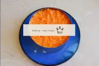 The top layer will be grated boiled carrots. Press...