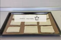 Place the rectangles on the baking sheet. Lubricat...