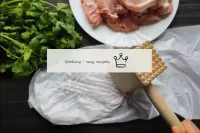 Cover a piece of loin with a cellophane bag and be...