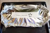 Cover the fish with a sheet of foil and carefully ...