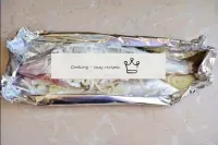 Wrap the foil around the fish as a boat and transf...