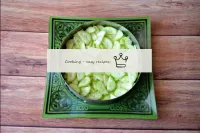 Peel the cucumbers and slice thinly. Place a layer...