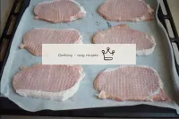 Cover the baking tray with cooking paper and place...