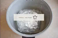 To bake, put the meat in the foil, without unfoldi...