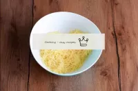 Grate the cheese and place in a bowl. ...