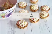Fill the tartlets with chilled crab salad. It is b...