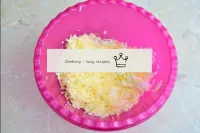 Grate eggs and cheese into a small bowl on a mediu...