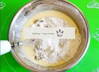 Pour the dry nut and flour mixture into the egg mi...