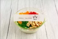 Put cubes of multi-colored jelly and cookies in th...