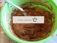 Add flour with cocoa in parts and mix in the same ...