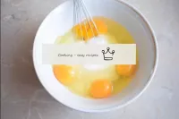 Drive the eggs into a bowl and pour in the sugar. ...