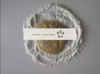 Pour the remaining flour onto a countertop and pla...