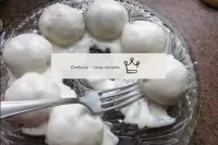 Place the cream-soaked balls on a wide dish around...