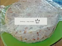 Remove the cling film from the cake. ...