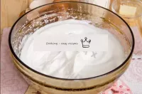 Without stopping whisking, gradually add half the ...