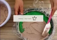 Brush the second green cake with chocolate cream. ...