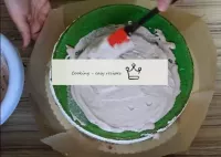 Place the bottom of the cake from the mold on a su...