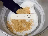 Add 150 grams of almond crumbs to the whipped prot...