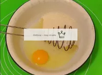 Let's cook the cakes. In a deep bowl, break an egg...