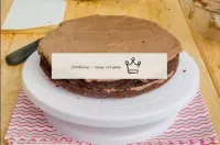 Put the second cake on top and cover it with the r...