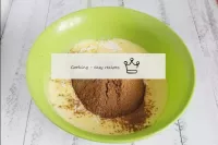 Sift flour and cocoa into a bowl with an egg mixtu...