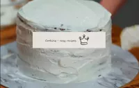 Spread the cream throughout the cake in an even la...